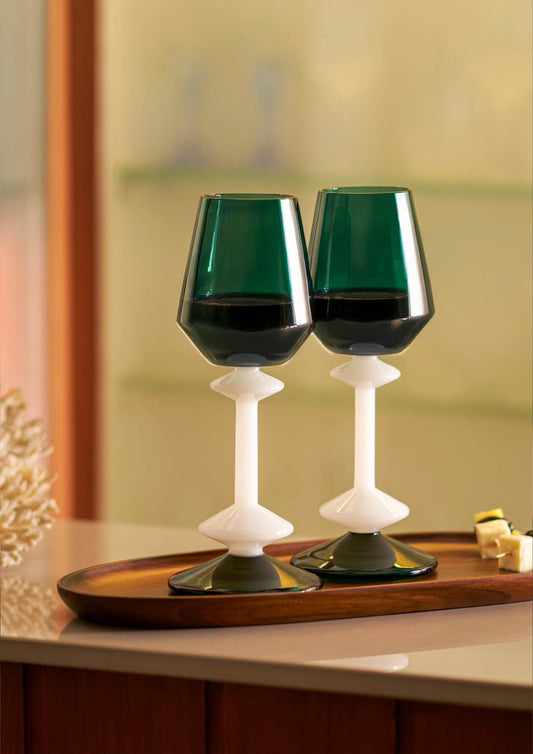 Premium wine glass with white stem and emerald bowl for elegant dining