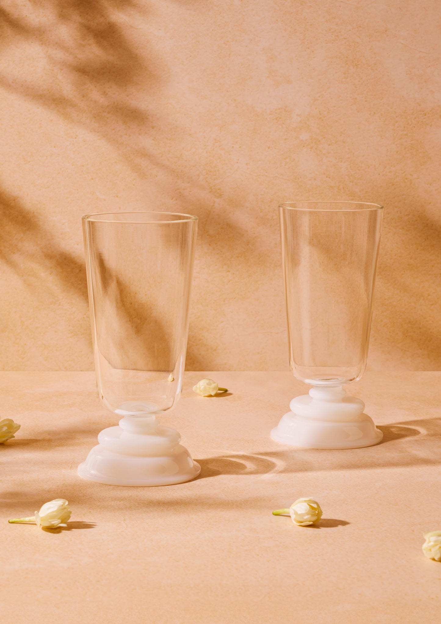 Elegant glass tumbler with white base styled with golden ornaments – Glass-Forest drinkware